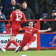 Sean McConville celebrates after scoring his first of the afternoon in the win over Bolton Wanderers