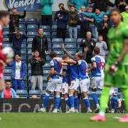 Sam Szmodics celebrates Blackburn Rovers' goal.