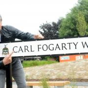 Carl Fogarty officially opens Carl Fogarty Way in Blackburn in 2019. Below, the former I'm a Celebrity champ pulls a pint of the Foggy Gold at his local boozer, The Spread Eagle in Mellor.