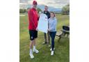 Club professional, Garnett Tarr, presents a Salesbury CC shirt to Jasmine Bell and Adam Pearson from My Adventure Campers