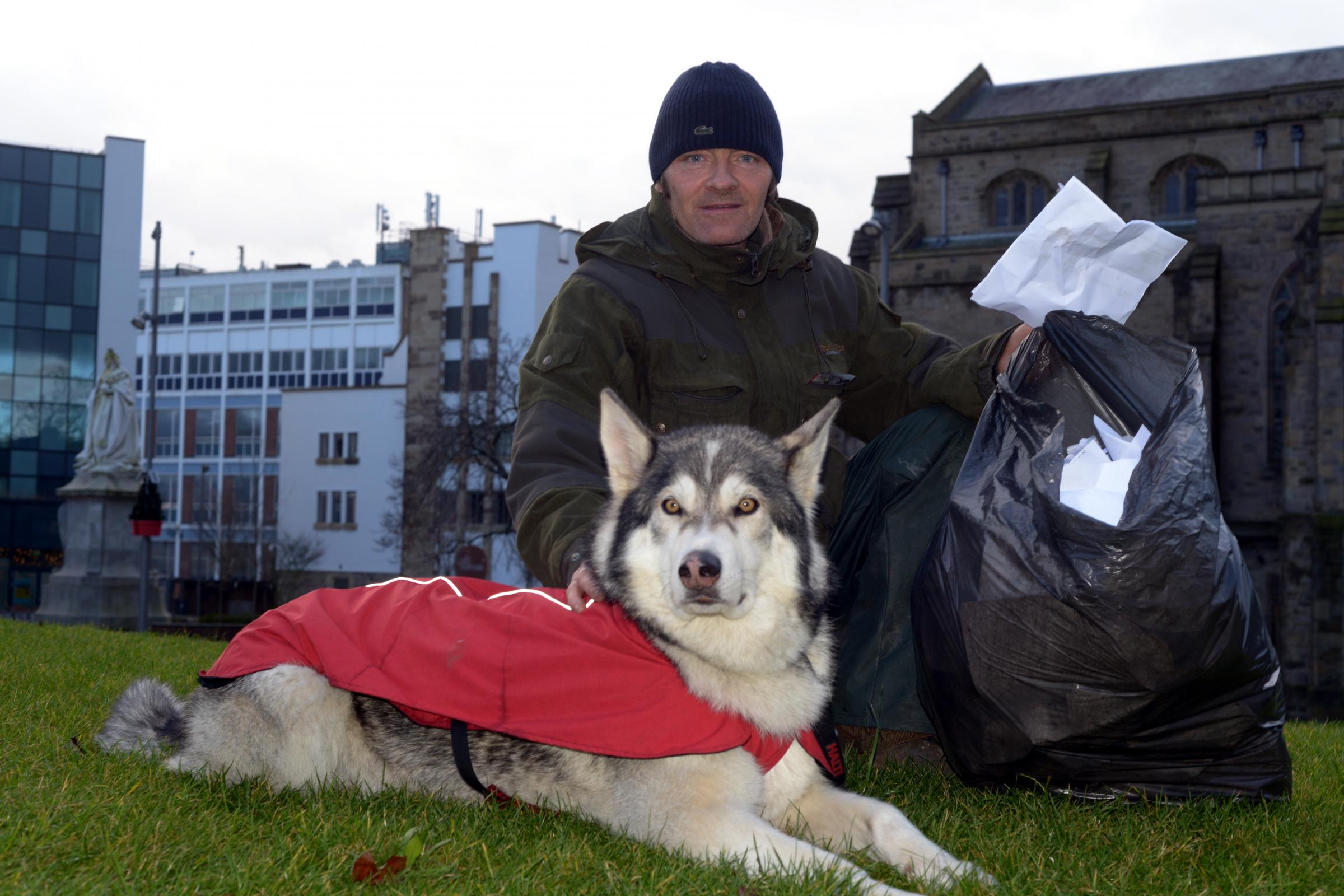 LITTER PICKER: Wayne Dixon, and his dog, Koda from Witton, Blackburn, are litter picking their way around Greate Britain.