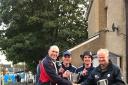 Settle chairman Andrew Davidson being presented with the league trophy by Bill Slinger with first-team players Ben Hulse and Robbie Davidson