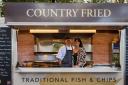 Simon Mathews and his wife, Helen, in their Country Fried mobile fish and chip van