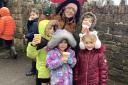 Mrs Rosie, after school club manager, and children enjoy their hot chocolate