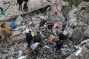 People search for victims in the rubble of a paramedic centre that was destroyed by an Israeli airstrike (AP Photo/Mohammed Zaatari)