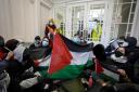 People take part in a pro-Palestine protest at the Department of Business and Trade (James Manning/PA)