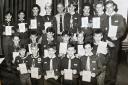 District Commissioner Jeff Harrison with Scouts who received their Scouts, Pathfinder and Explorer Awards at Blackburn and District Scouts annual awards evening in 1990