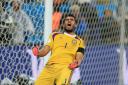 Argentina goalkeeper Sergio Romero celebrates victory in the penalty shoot-out during the FIFA World Cup Semi Final at the Arena de Sao Paulo, Sao Paulo, Brazil