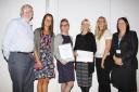 The Staff Wellbeing Service, with Manager Katie Kay (second from left) receiving the Principles of Care Award.