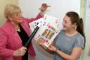 Magician Ann Walmsley creates some magic with cards and a wand for 16-year-old Leah Hillman