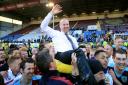 MANAGER OF THE YEAR: Sean Dyche celebrates promotion with his squad after Burnley beat QPR