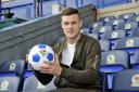 ON THE BALL: Anthony Stokes signs in at Rovers yesterday after becoming Owen Coyle's first signing