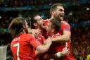 SPIRIT: Sam Vokes celebrates his header against Belgium with some of his Wales teammates