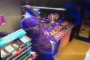 CCTV footage shows two men during the robbery at General Stores in Blackburn