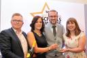 Paul Hibbs (left) presents the award to Laura Miller, Paul Burns and Tina Wilkinson of St Andrew's CE Primary School, Oswaldtwistle.