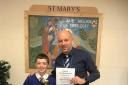 Dylan Walden recieving his award for 100 per cent attendance