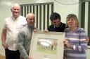 PRESENTATION: Tom and Lesley Allon either side of the painting of Scholes Bank, with new Horwich St Mary’s secretary Russell Walmsley, left, and new chairman Danny Barry