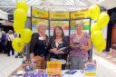 TASTY OFFER Promoting the catering service at Mill Gate shopping centre are Christine Rothwell, area manager, Helen Jessop, supervisor at Cams Lane Primary School, and Sue Nicholls, area manager