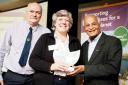Andrew and Rachel Turner of Malkin Tower Farm receive their award from Satish Kumar