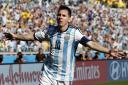 Magic Messi sends Argentina through to knockout stages