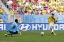 Colombia's Juan Quintero fires past Ivory Coast's goalkeeper Boubacar Barry to score his sides's second goal