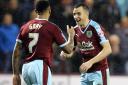 KEY: Dean Marney celebrates with Burnley teammate Andre Gray during the 4-0 win over Charlton
