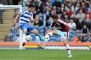 IMPACT: Burnley midfielder Joey Barton looks to win back the ball during his Clarets debut against Reading