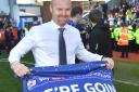 FLAG DAY: Burnley manager Sean Dyche celebrates his side’s promotion to the Premier League
