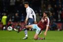 IN FORM: Preston North End’s Callum Robinson is tackled by Burnley’s George Boyd Picture: CAMERA SPORT