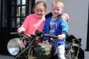 Megan,10 and Jake Clough, 6, from Padiham tries out an old motorbike.