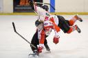 TUMBLE: Action from Blackburn Hawks’ Sunday night victory over Solihull Barons Pictures: KIPAX