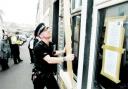SHUTDOWN: Worried neighbours watch as police close a drugs den in Waterbarn Street, Burnley
