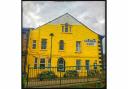 Golden Lion 2 - Gable end of Todmorden pub painted yellow