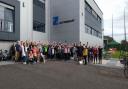 Staff at H&T Presspart in Blackburn celebrating their fundraising efforts