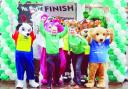 STARTING UP: Mike Tomlinson and former Olympic athlete Steve Cram join charity and sports mascots to launch the 10k