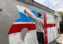 Keiron 'Curly' Whitehead, Darwen's resident grafitti artist has painted a huge Union Jack on the side of the British Queen's beer garden ready for the pub's re-opening on May 17