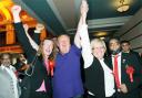 CELEBRATION: Labour’s Jim Smith celebrates with supporters  after winning Blackburn’s Mill Hill seat