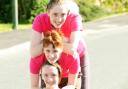 Helen with her two daughters, Jessica, 18, and Megan, 13, who will be joining her in the Race for Life