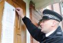 ACTION: Sgt Mark Cruise puts up the notice