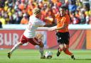 Holland striker Robin van Persie takes on Denmark opponent Simon Kjaer