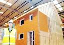 SAFE AS HOUSES: Pretek boss Peter Marshall inside the new giant works in Blackburn where pre-packed eco-friendly homes will be built