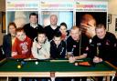 MASTERCLASS: Steve Davis, second from right, with Coun Perks, third left, with Paul Thomas and Phil Harrison and members of the youth group on their visit to Squires snooker club, Lancaster