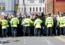 IN CONTROL Police contain the EDL protesters in Mincing Lane, Blackburn
