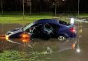 Car submerged in water on flooded road in Buckshaw Village