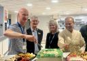 Head of hospital charities Dan Hill, Rosemere Cancer Foundation’s chairman John Hodgson and fundraising manager Sue Swire join Professor Mohammed Munavvar in serving food at the iftar