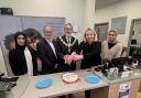 Mayor of Pendle Cllr Brian Newman celebrating Specsavers fifth anniversary in Colne with staff