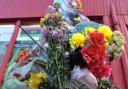 Flowers left at the scene in Kulsuma Akter's memory