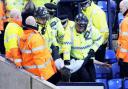 A fan is arrested at Tuesday's match