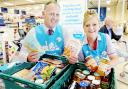 Tesco staff Richard Cross and Tracey Gleave collect for Fair Share in Burnley