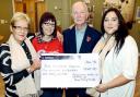 Gail Regan, Kim Hall, John Hargreaves and niece Holly Regan with the cheque in Gina’s memory